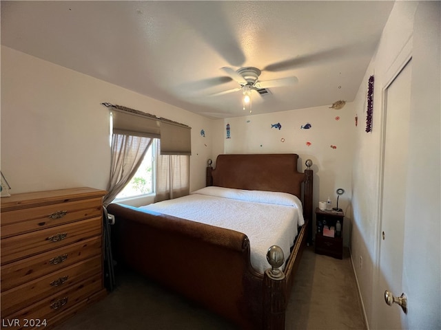 bedroom with dark carpet and ceiling fan