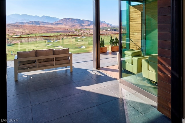 entryway featuring a mountain view and tile patterned floors