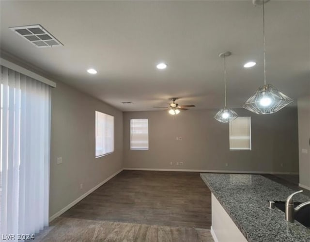 spare room featuring sink, dark hardwood / wood-style flooring, and ceiling fan