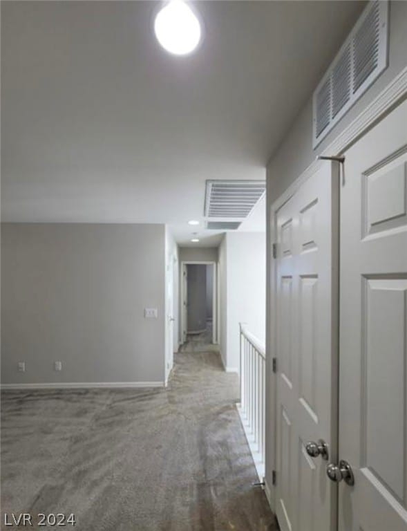 hallway featuring carpet flooring