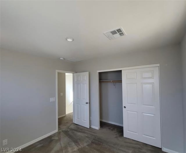 unfurnished bedroom with a closet