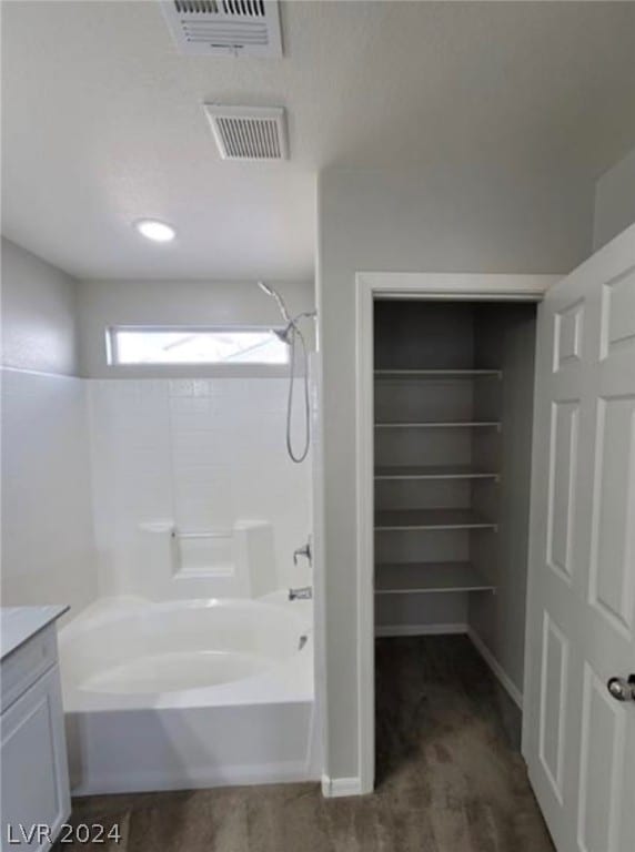 bathroom with shower / tub combination and vanity