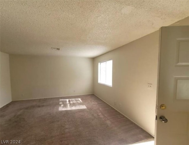 4300 N Lamont St Unit 232, Las Vegas, NV 89115 - carpeted spare room with a textured ceiling