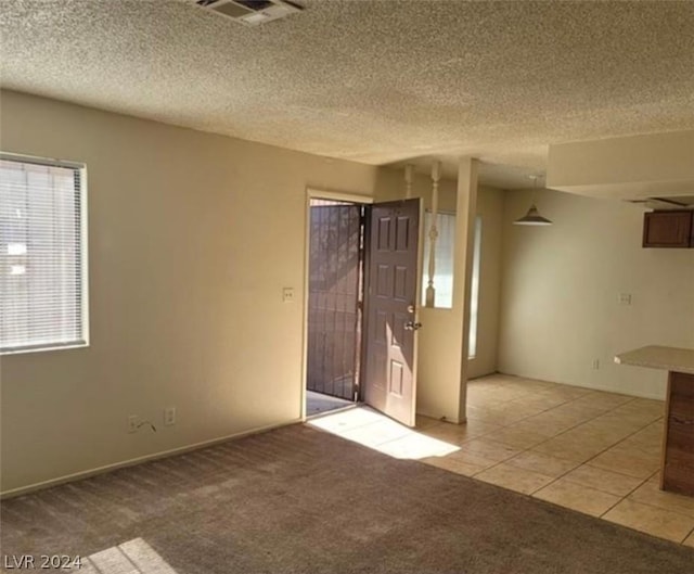 4300 N Lamont St Unit 232, Las Vegas, NV 89115 - empty room featuring light colored carpet and a textured ceiling