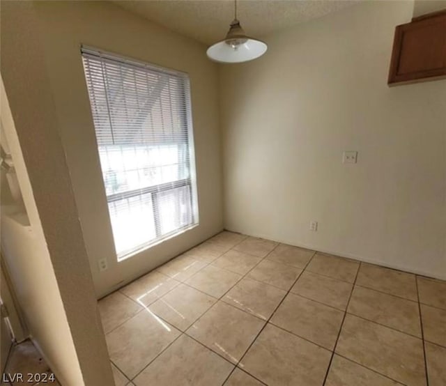4300 N Lamont St Unit 232, Las Vegas, NV 89115 - unfurnished dining area featuring light tile patterned floors