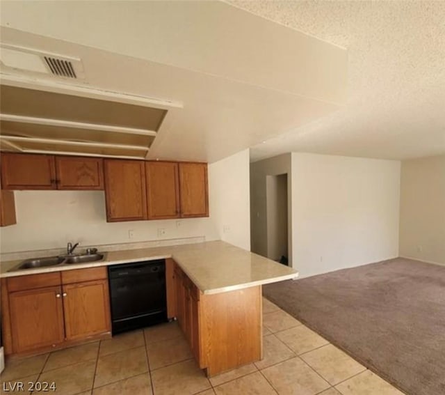 4300 N Lamont St Unit 232, Las Vegas, NV 89115 - kitchen with kitchen peninsula, sink, black dishwasher, a textured ceiling, and light carpet