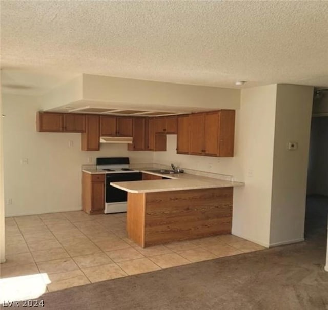 4300 N Lamont St Unit 232, Las Vegas, NV 89115 - kitchen featuring a textured ceiling, white electric range oven, sink, kitchen peninsula, and light tile patterned floors