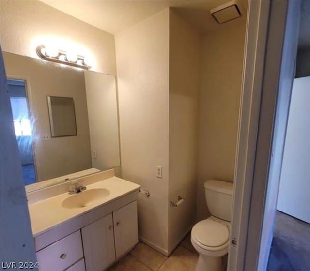 4300 N Lamont St Unit 232, Las Vegas, NV 89115 - bathroom featuring toilet, vanity, and tile patterned floors