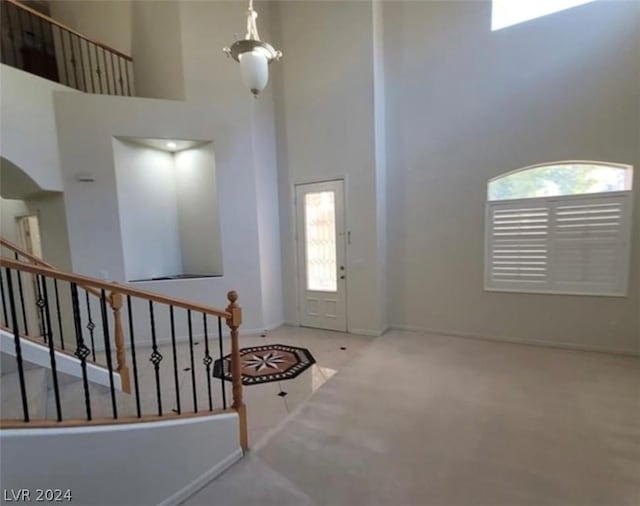 entryway featuring a high ceiling