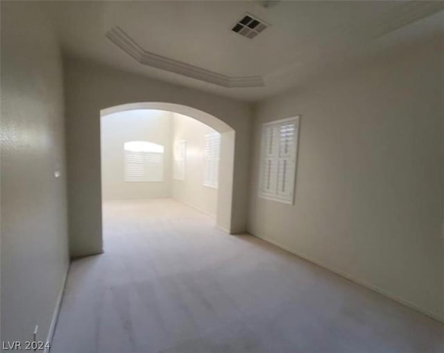 unfurnished room with light carpet