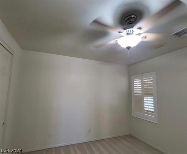 unfurnished room with ceiling fan