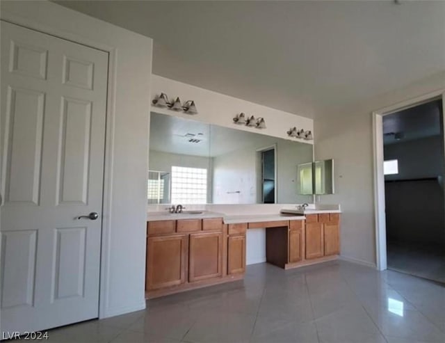 bathroom with tile patterned flooring and vanity