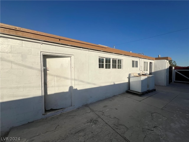 view of home's exterior with central AC and a patio area