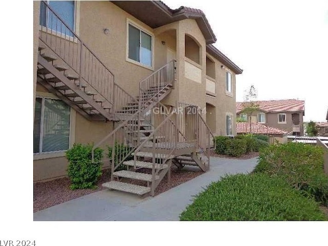 view of building exterior featuring stairway