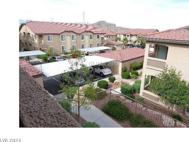 exterior space with a residential view and uncovered parking