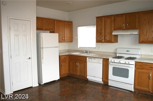 kitchen featuring white appliances, extractor fan, and sink