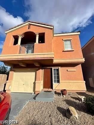 view of front of house with a garage and a balcony