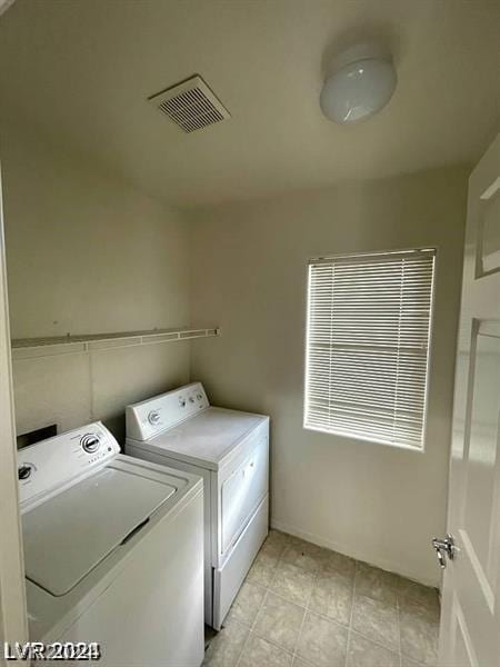 laundry room with separate washer and dryer