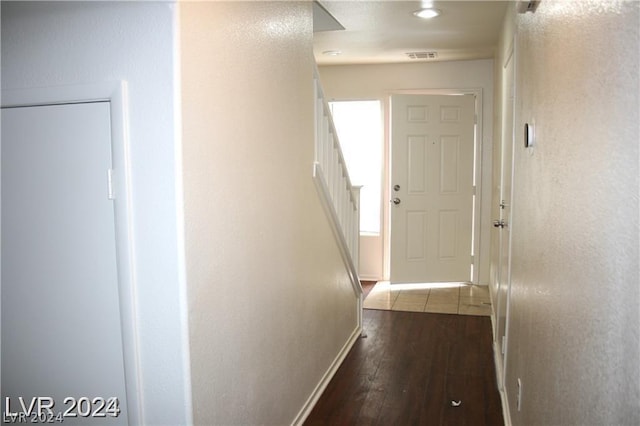 corridor featuring hardwood / wood-style floors