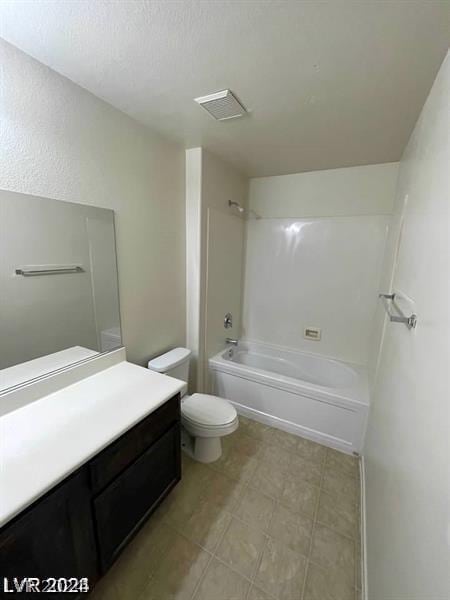 full bathroom featuring vanity, tub / shower combination, and toilet