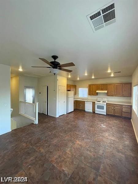 unfurnished living room with ceiling fan