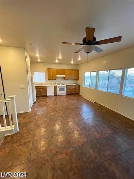 kitchen with white appliances and ceiling fan