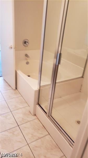 bathroom featuring shower with separate bathtub