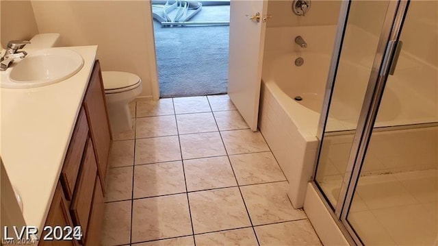 full bathroom featuring independent shower and bath, vanity, tile patterned floors, and toilet