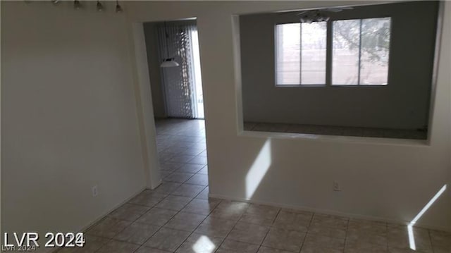 empty room with light tile patterned flooring