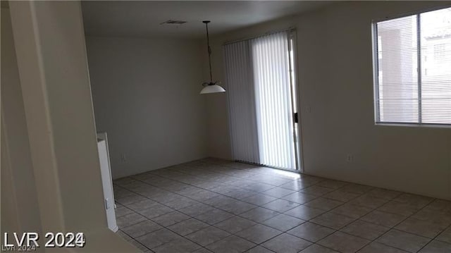 spare room with tile patterned flooring