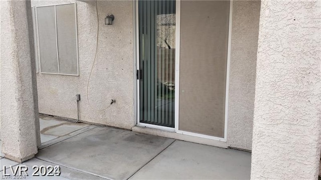 doorway to property featuring a patio