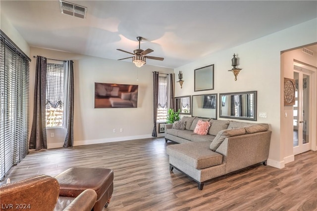 living room featuring hardwood / wood-style flooring and ceiling fan