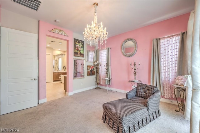 living area featuring an inviting chandelier and light colored carpet