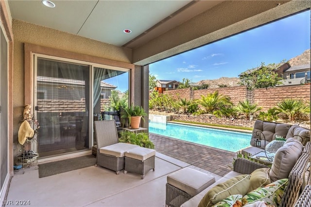 view of pool featuring an outdoor hangout area and a patio