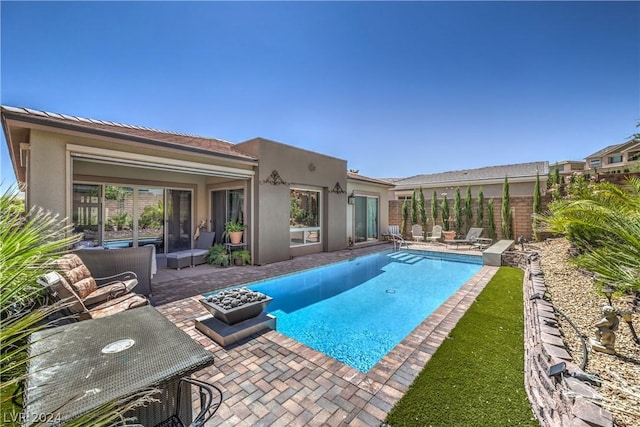 view of swimming pool with a patio area