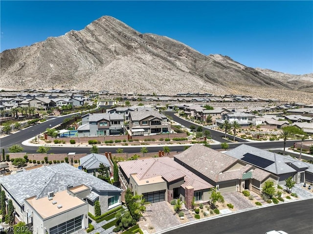 birds eye view of property featuring a mountain view