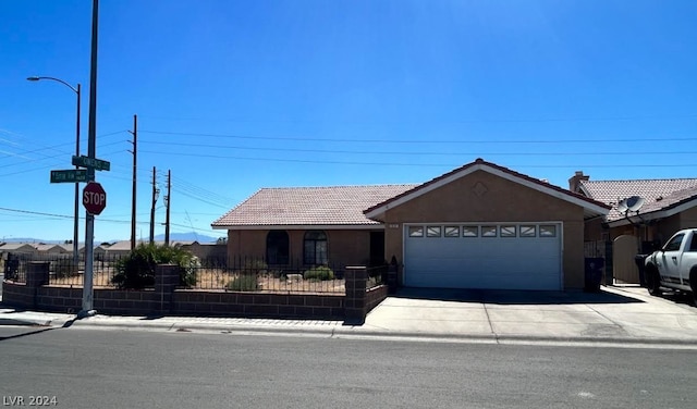 ranch-style home featuring a garage