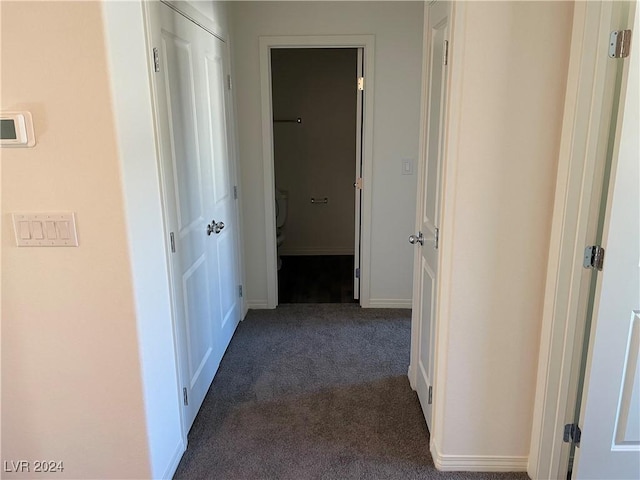 corridor with dark carpet