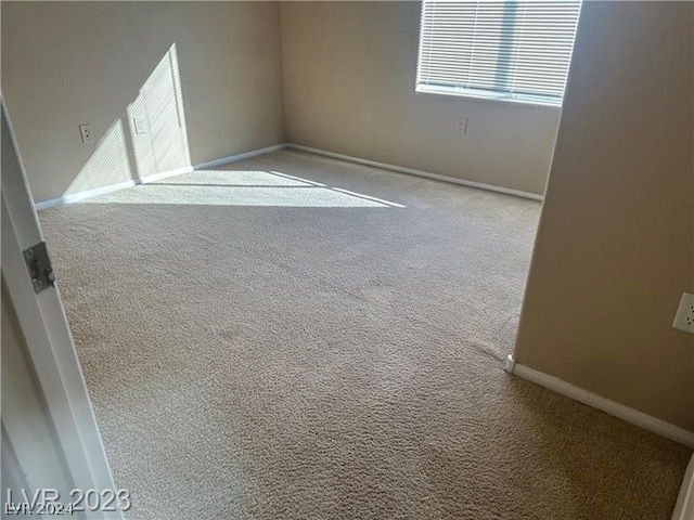 unfurnished room with carpet floors