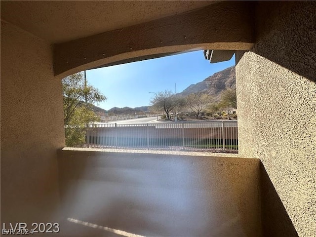 balcony featuring a mountain view