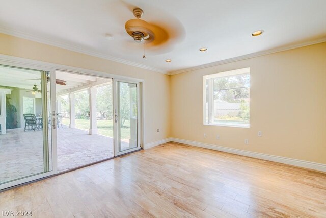 unfurnished room with ceiling fan, crown molding, and light wood-type flooring