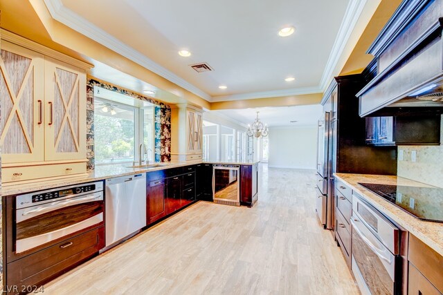 kitchen with custom range hood, stainless steel appliances, light hardwood / wood-style flooring, light stone counters, and beverage cooler