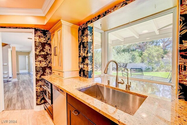 kitchen with sink, beamed ceiling, and a wealth of natural light