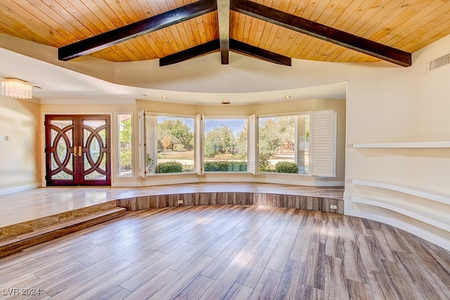 unfurnished living room featuring wood-type flooring, french doors, lofted ceiling with beams, and wood ceiling