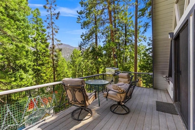 wooden terrace featuring a mountain view