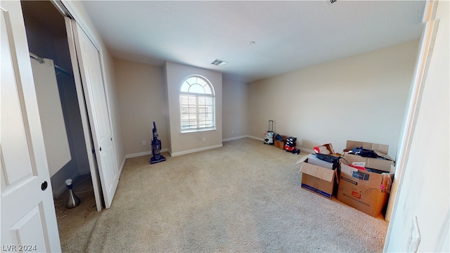 interior space featuring light colored carpet