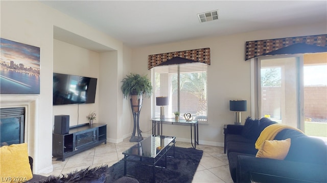 tiled living room with a wealth of natural light