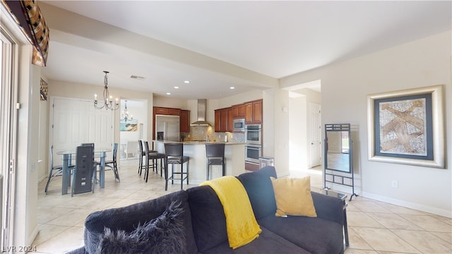 living room with an inviting chandelier and light tile patterned flooring