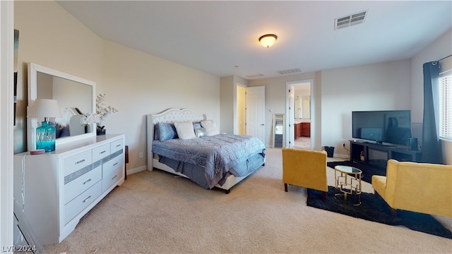 carpeted bedroom featuring connected bathroom