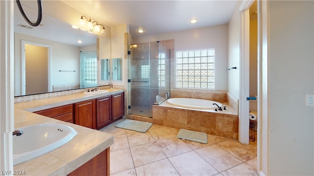 bathroom featuring tile patterned flooring, shower with separate bathtub, a healthy amount of sunlight, and vanity